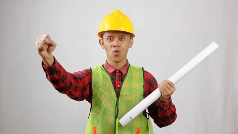 Energetic construction worker celebrating project success Stock Footage 319968337