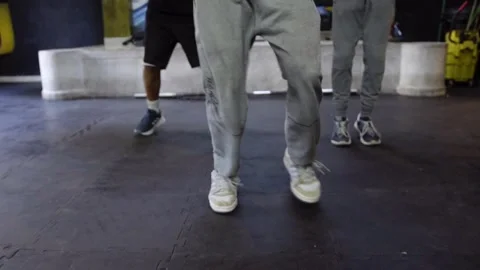 Energetic Dance Group in Gym Showcasing Teamwork and Dynamism Видео 331053001