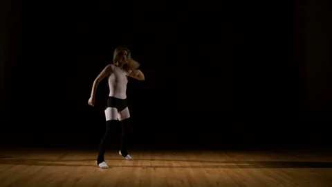 Energetic dancer performing acrobatic dance sequence Stock Footage 74717945