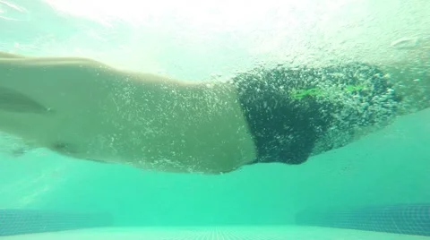 An energetic dive into a swimming pool, Slow Motion Stock Footage 53214122