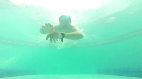 An energetic dive into a swimming pool, Slow Motion Stock Footage 53214183