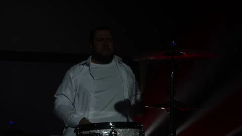 Energetic drummer delivering an electrifying performance on stage Stock Footage 292008689