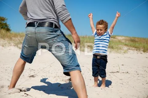 Energetic kid raises arms Stock Photos