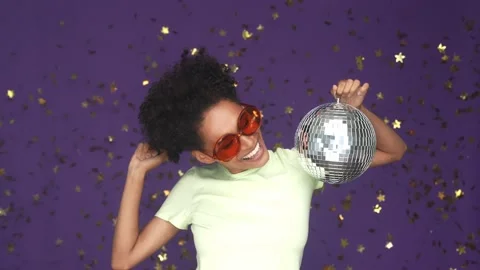 Energetic lady dance disco ball confetti isolated violet colorbackground Stock Footage 165879043
