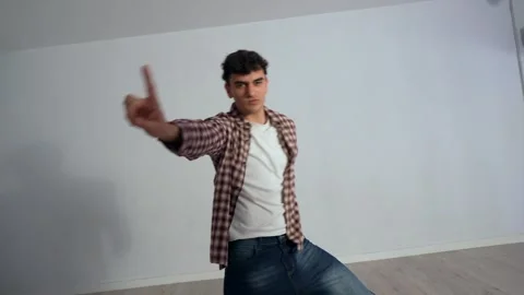 Energetic male dancer performing dynamic choreography in studio Stock Footage 305046941