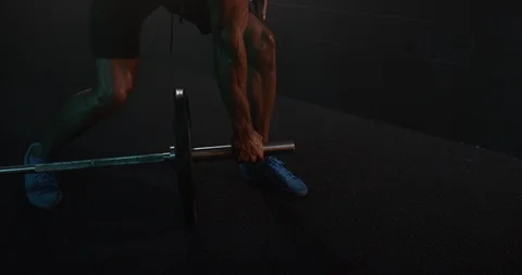 Energetic man doing heavy weight exercise with barbell in gym Stock Footage 116360474