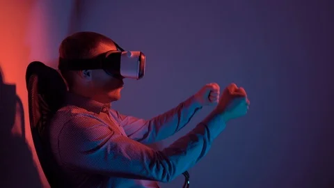 Energetic man in virtual reality glasses playing a video game Stock Footage 101848428