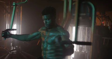 Energetic man working out with exercise equipment Stock Footage 116358023