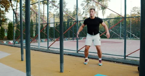 An Energetic Outdoor Workout Routine Tailored for Fitness Enthusiasts in Motion Video stock 317756833