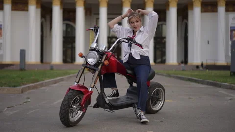 Energetic Performer Thrilling Everyone While Riding a Mini Scooter Joyfully Stock Footage 312981630