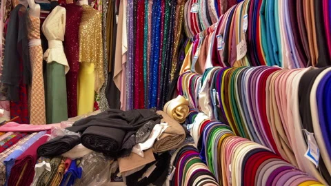 Energetic Retail Space Featuring Variety Of Luxurious Textiles And Elegant Dress Stock Footage 337939027
