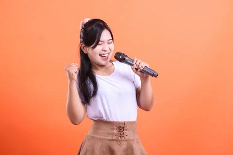 Energetic Singer Performing on a Stage Stock Photos