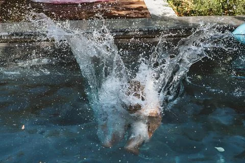 Energetic Splash from Pool Dive Stock Photos