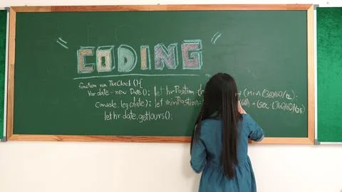 Energetic student standing blackboard while writing coding program. Pedagogy. 스톡 사진