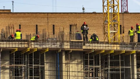 Energetic work of cranes and construction workers during the construction of  Stock Footage 182422277