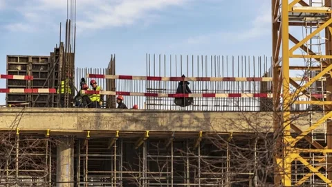 Energetic work of cranes and construction workers during the construction of  Video stock 182422505