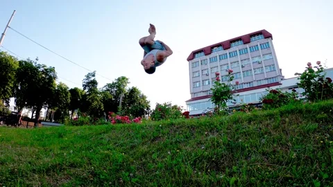 An energetic young man enjoys active recreation and parkour in the heart Stock Footage 319072352