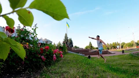 An energetic young man enjoys active recreation and parkour in the heart Stock Footage 319072354
