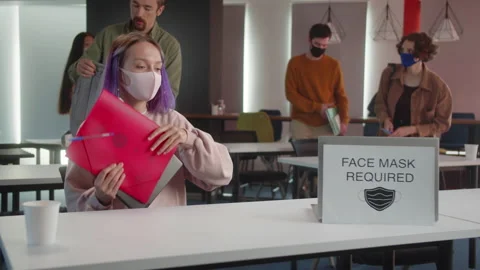 Energetic young students in the protective face masks are preparing for the Stock Footage 175401144