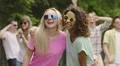 Energetic youth enjoying party in park, summer activities, dancing outdoors HD Footage