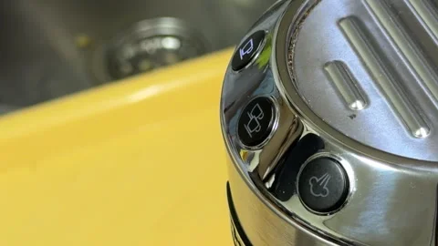 Energizing Morning: Coffee Machine Pumps Water to Create a Vibrant Brewing Hiss Video stock 329166834