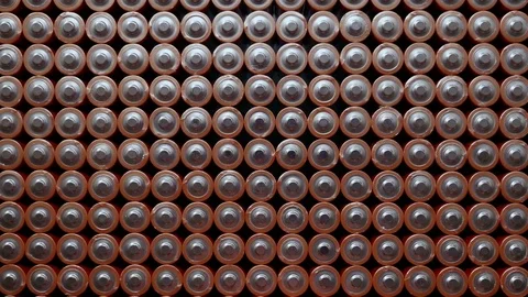 Energy abstract Background of Batteries. The top view of the AA-Size Battery Stock Footage 77361957