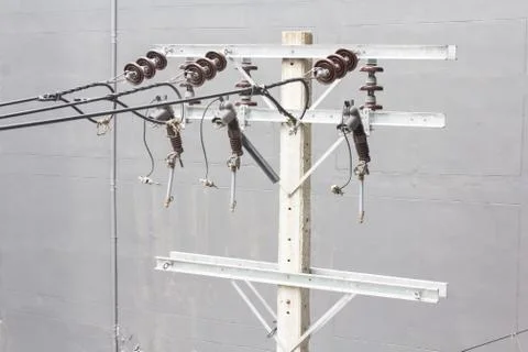 Energy and technology: electrical post  with power line cables Stock Photos