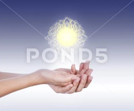Energy ball levitates on hands Stock Photos