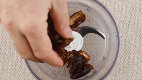 Energy Balls. Step by step recipe cooking. Ingredients poured blender bowl. p1 Vidéo 123292899