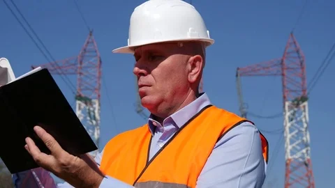 Energy Distribution Company Engineer Study and Take Notes in Technical Agenda Video stock 74985919