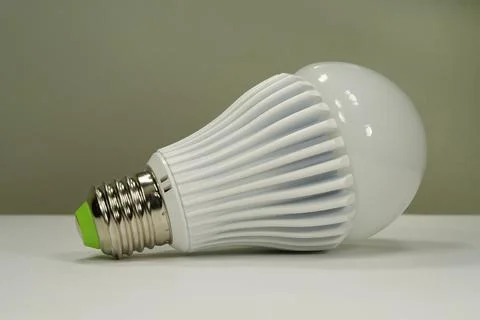 Energy efficient E27 LED lamp glowing brightly for modern home interiors Stock Photos
