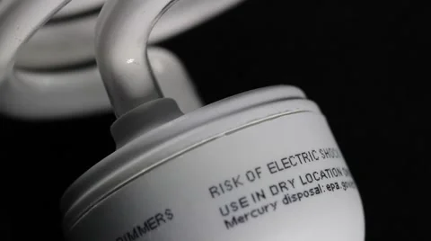 Energy efficient light bulb rotating on product table with black background Stock Footage 47456031