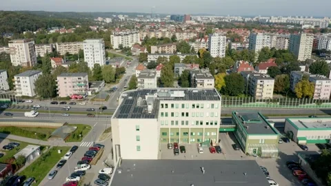 Energy-Efficient Rooftop Design With Solar Panels In Cityscape Seen From Drone Video stock 314114874