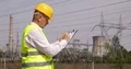 Energy-Engineer Maintains Electrical Equipment Writing Observations in Clipboard 4k or 4k+ Resolution