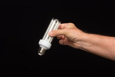 Energy-saving bulb, ready to be installed Stock Photos