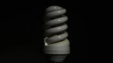 Energy saving compact fluorescent light bulb Stock Footage 90018118