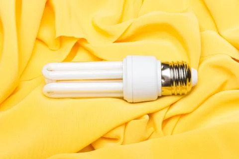 Energy saving light bulb and white light; home and work lighting. Stock Photos