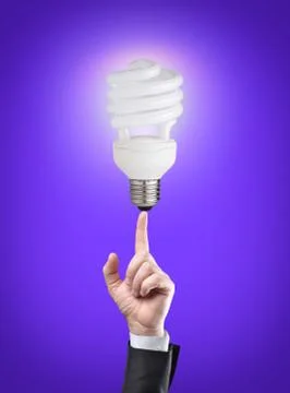 Energy saving light bulb on tip of finger on businessman Stock Illustration