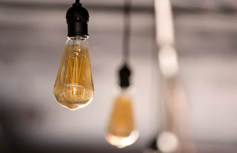 Energy saving vintage LED bulbs hanging Stock Photos