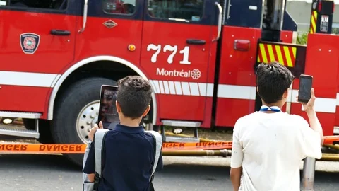 Enfant filming fire scene with electronics Stock Footage 114799003