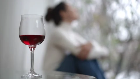 Engage in a Contemplative Evening Experience While Enjoying a Glass of Fine Wine Stock Footage 309380846