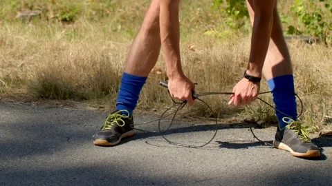 Engage in Jump Rope Preparation by using Quality Athletic Gear Outdoors Stock-Footage 318925697