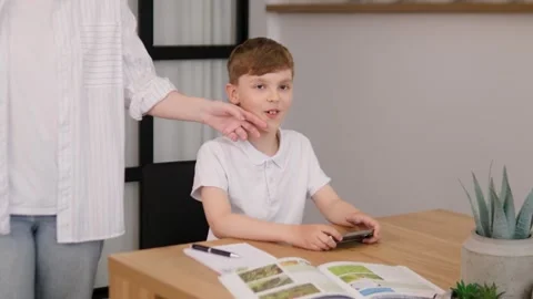 Engaged Child Learning at Home with a Mobile Device for Enhanced Educational Stock Footage 312219731