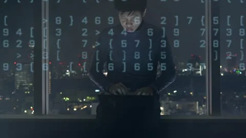 Engaged in Coding at Night with City View Stock-Footage 315116646