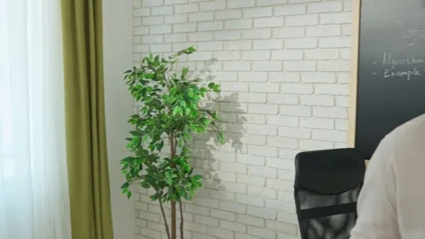 Engaged Computer Science Instructor Teaching in Modern Classroom Stock Footage 281071499