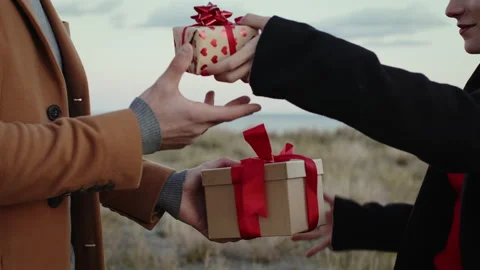 Engaged Couple Exchanges Gifts box for valentines day Stock Footage 168869340