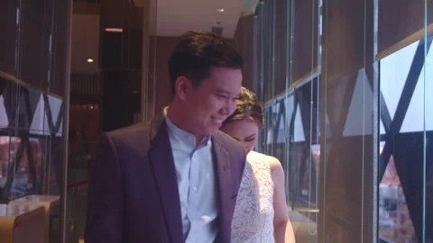 Engaged Couple Gazing and Walking Together in Hotel Lobby Stock Footage 334090739