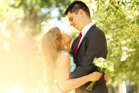 Engaged couple posing in the park Stock Photos