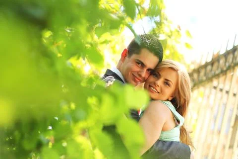 Engaged couple posing in the park Stock Photos