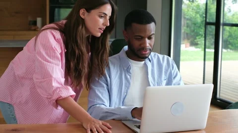 Engaged Diverse Couple Collaborating on Laptop, Sharing Ideas and Working Togeth 스톡 동영상 333539133